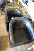 Two black leather effect tub chairs