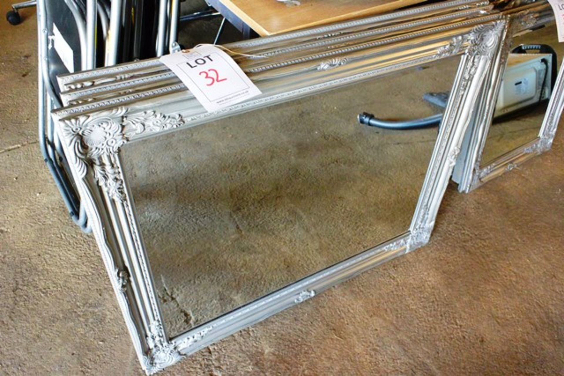 Three ornate framed large mirrors