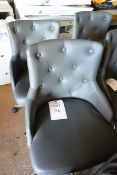 Two grey leather effect, mobile chairs
