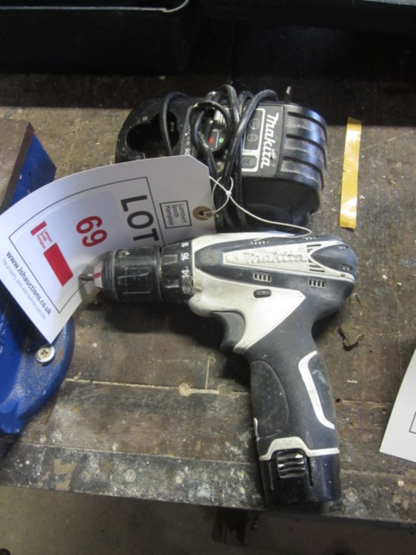 Makita cordless drill and charger. Located at main schoolPlease note: This lot, for VAT purposes, is