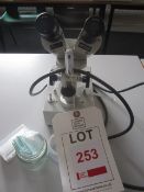 Heiji SKC11369 binocular microscope and slides. Located at main schoolPlease note: This lot, for VAT