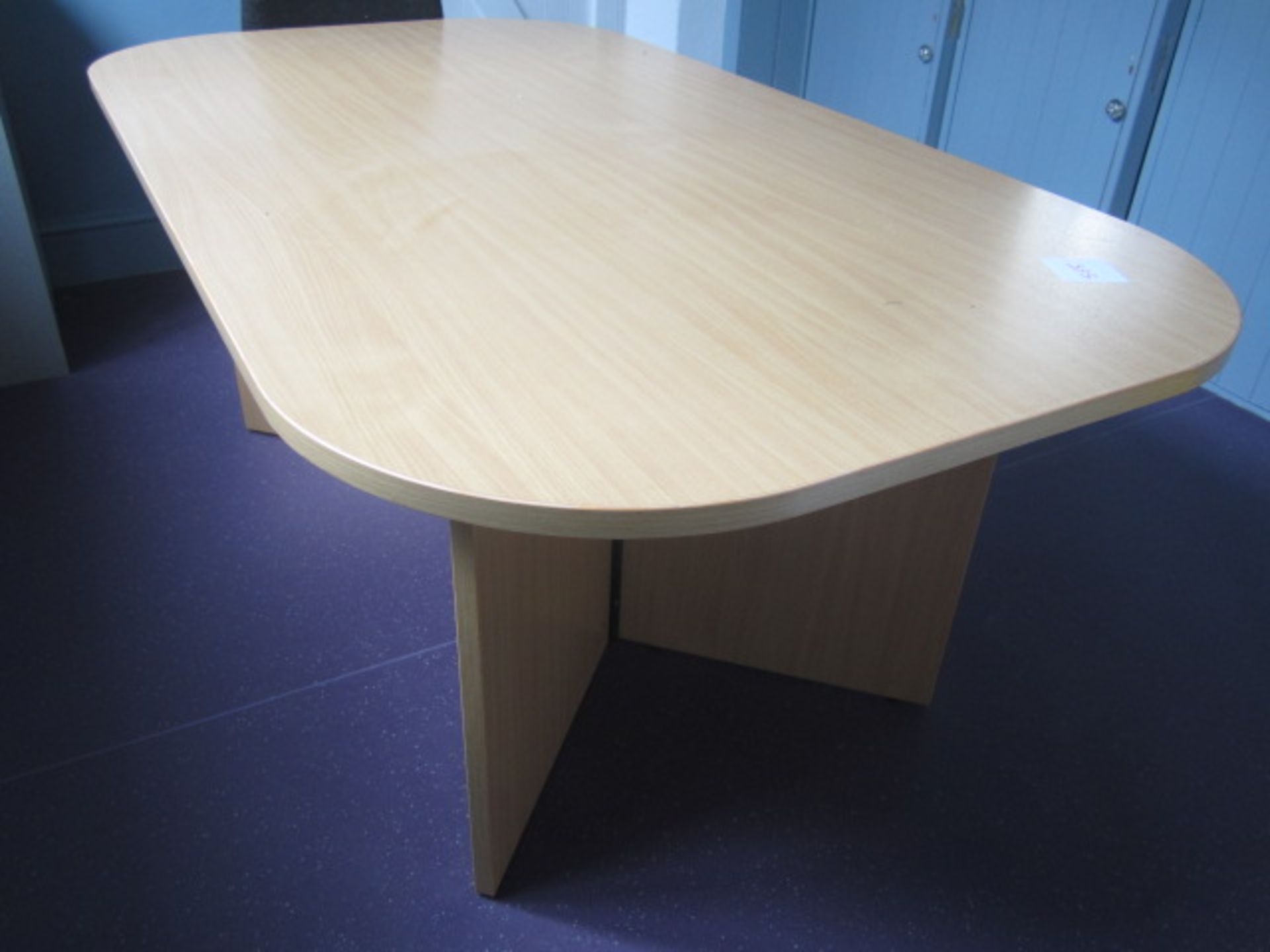 Lightwood effect meeting table and wood effect 2 door storage cupboard. Located at 6th form