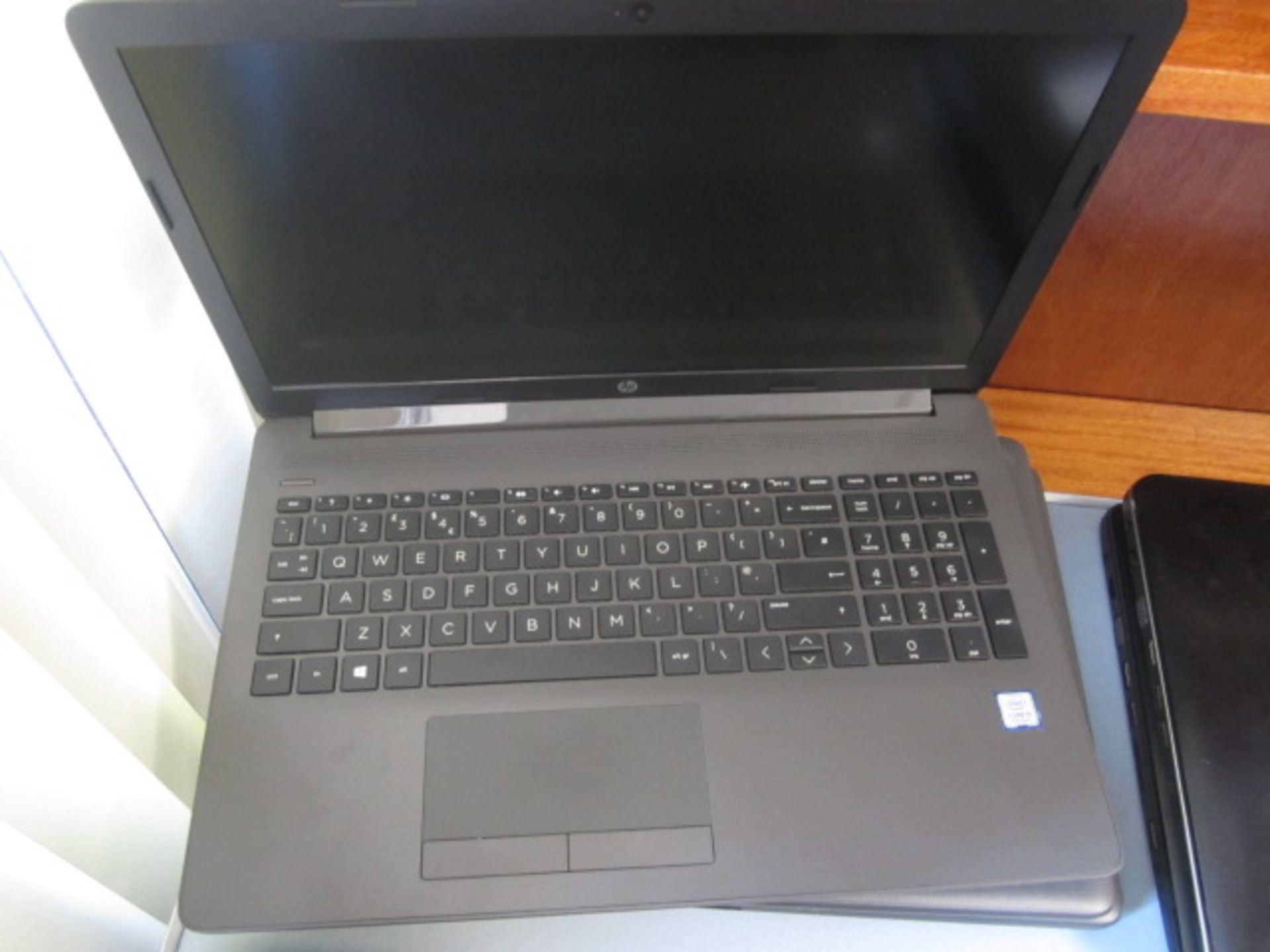 HP 250 G7 Core i3 laptop and case. Located at main schoolPlease note: This lot, for VAT purposes, is