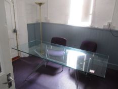 Glass top rectangular table, 2 x upholstered chairs, uplighter. Located at 6th form premises