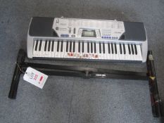 Casio CTK-496 100 song bank electric keyboard with folding stand. Located at main schoolPlease note: