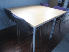 2 x metal frame lightwood effect tables with 4 x upholstered chairs. Located at 6th form