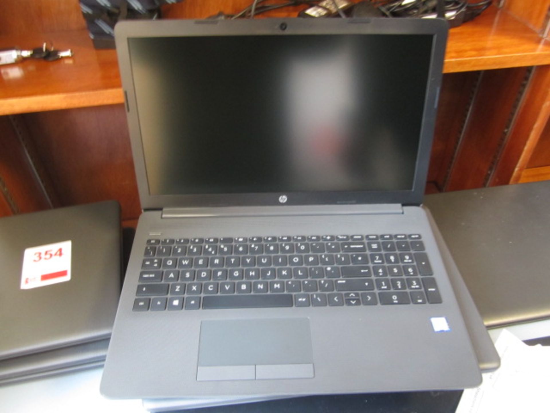 HP 250 G7 Core i3 laptop and case. Located at main schoolPlease note: This lot, for VAT purposes, is