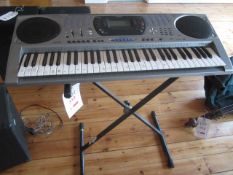 Casio CTK-671 electric keyboard and folding stand. Located at main schoolPlease note: This lot,