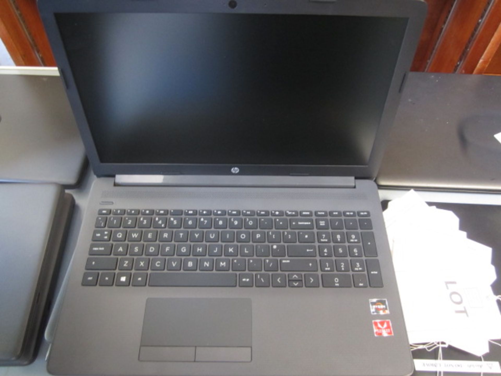 HP 255 G7 Rysen 3 laptop and case. Located at main schoolPlease note: This lot, for VAT purposes, is