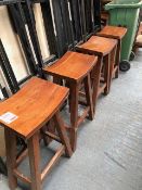 Four dark wood bar stools