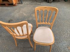 Sixty wooden framed dinning chairs with Velcro fitted cloth cushions