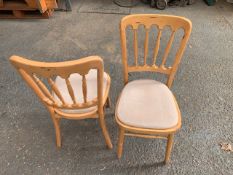 Thirty Five wooden framed dinning chairs with Velcro fitted cloth cushions