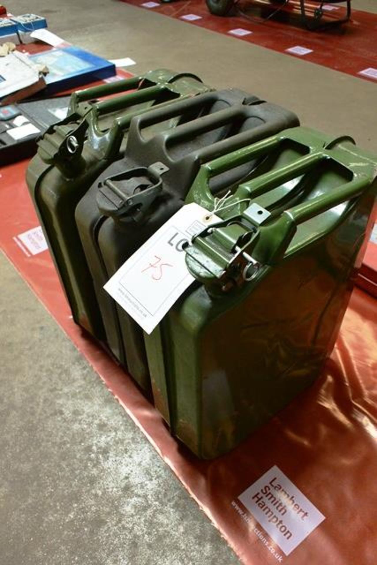 Three 'jerry can' type fuel cans