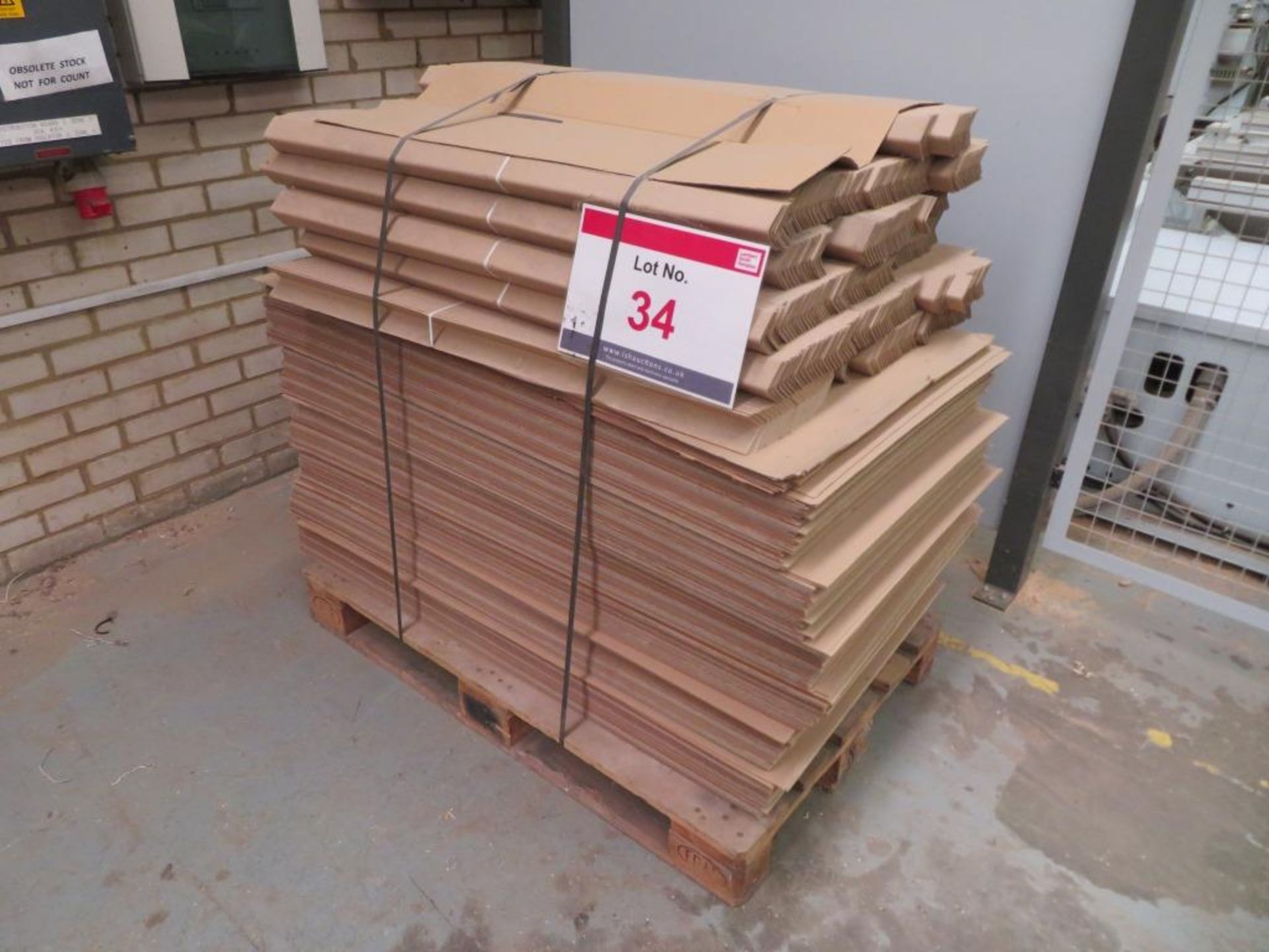A pallet of cardboard sheets and corner protectors