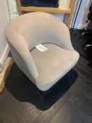 Grey velvet tub chair with black feet