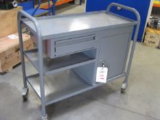 Four Wheel work trolley with cupboard and drawer