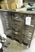Three 12 drawer steel filing cabinets, with contents to include various fuses, lamps, connectors,