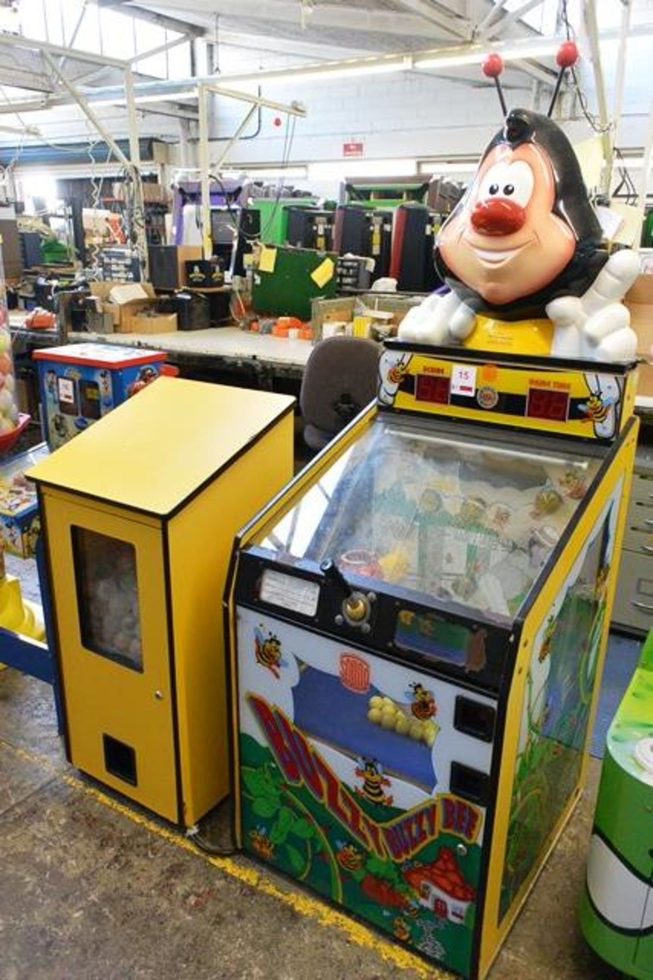 Sound Leisure Systems "Buzzy Buzzy Bee" pay to play machine, with associated prize dispenser (