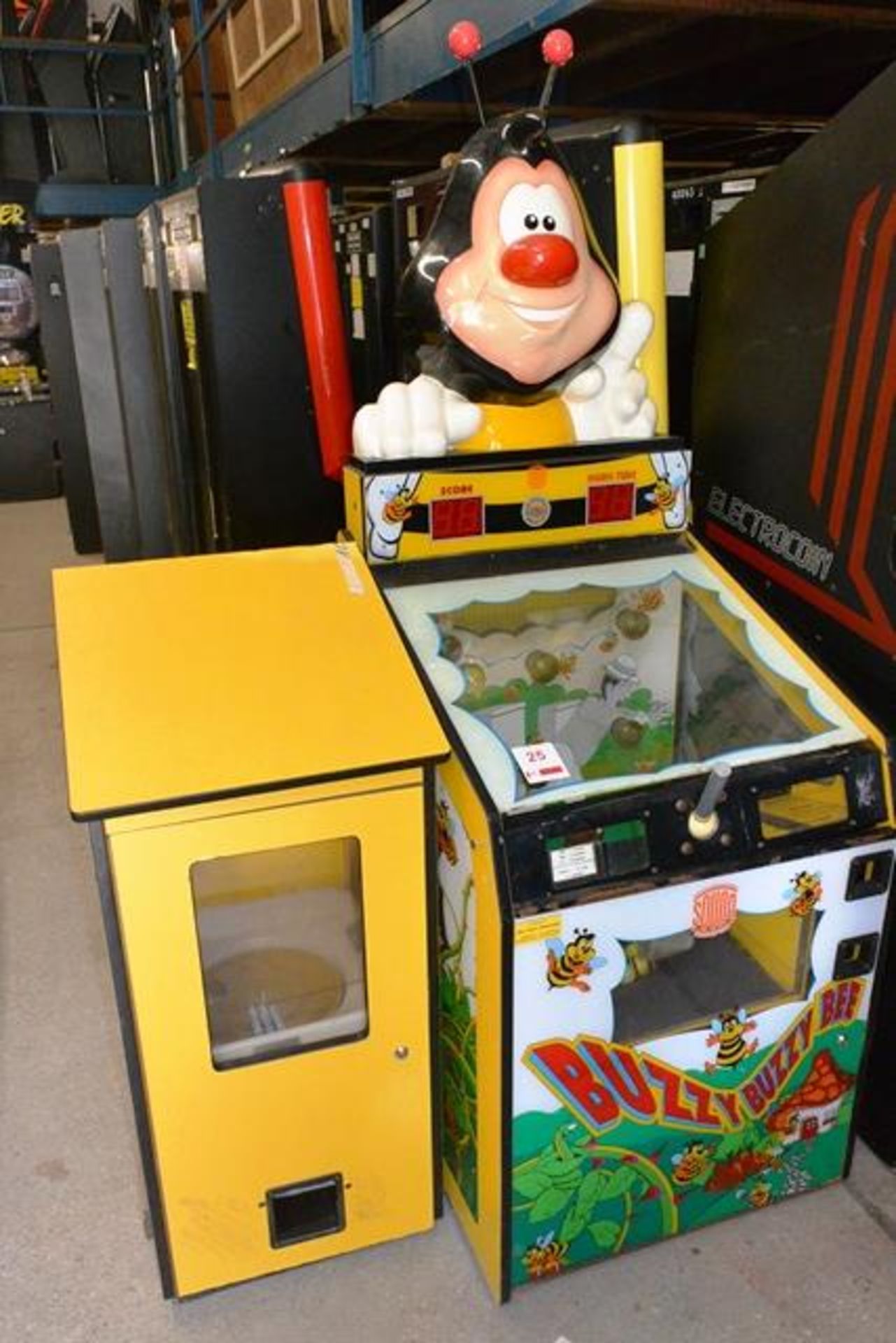 Sound Leisure Systems "Buzzy Buzzy Bee" pay to play machine, with associated prize dispenser (