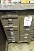 Two multi drawer steel filing cabinets including contents, to include various switches, levers,