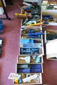 Eight boxes and contents to include various hand tools, sharpening stones, grease gun, etc.