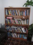 Wood effect bookcase with contents of assorted books,Located at main school,** Located at Shapwick