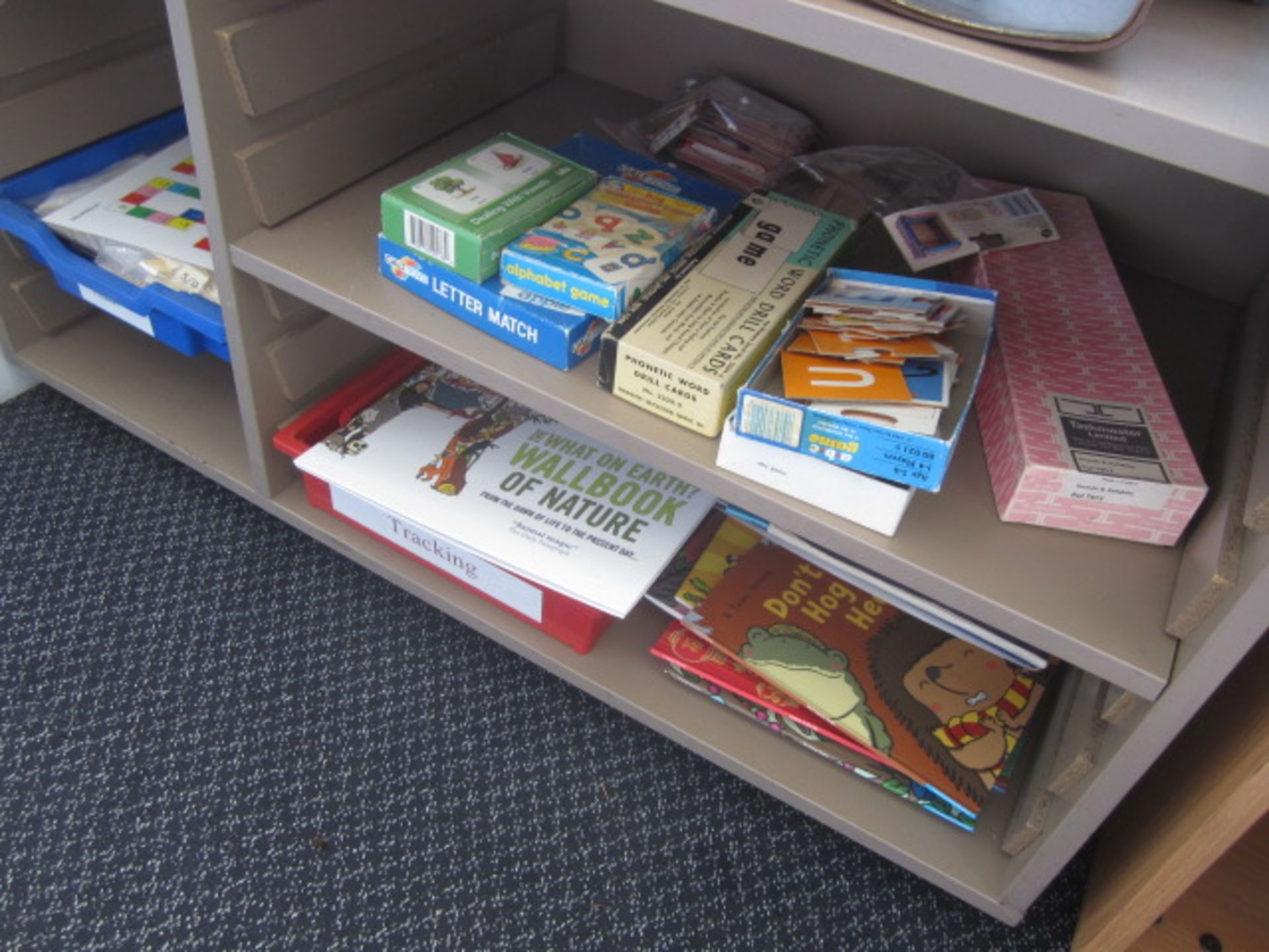 Wood effect bookcase with assorted books, teaching aids, board games, books etc.,Located at main - Image 12 of 13