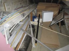 Contents of mezzanine including decking, drain pipe, conduit, skirting board, white wall boards,