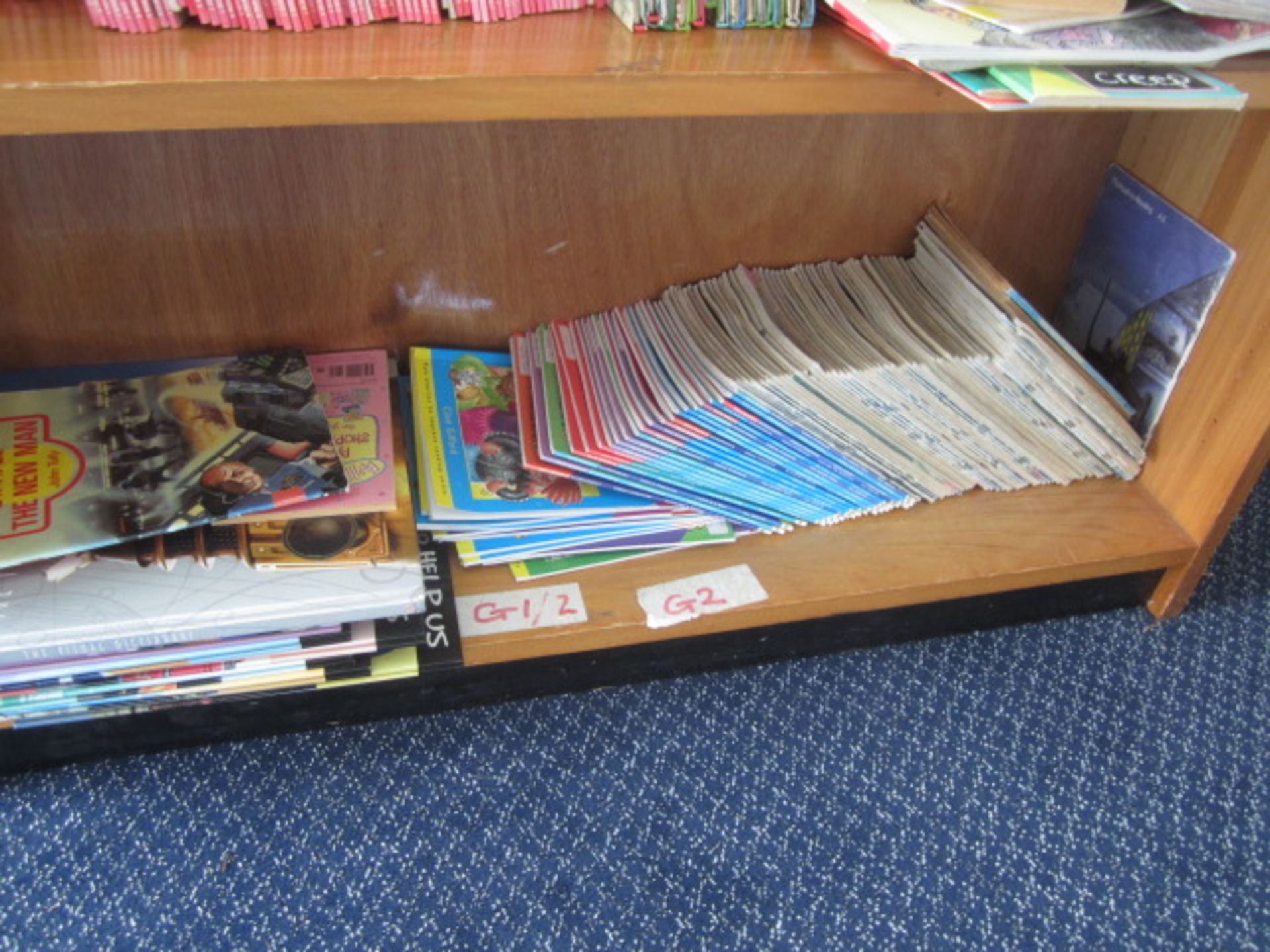 Wood effect bookcase with assorted books, teaching aids, board games, books etc.,Located at main - Image 4 of 13