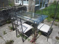 Metal frame glass top patio table, 920mm x 1.5m with 6 x metal frame chairs,Located Greystones,**