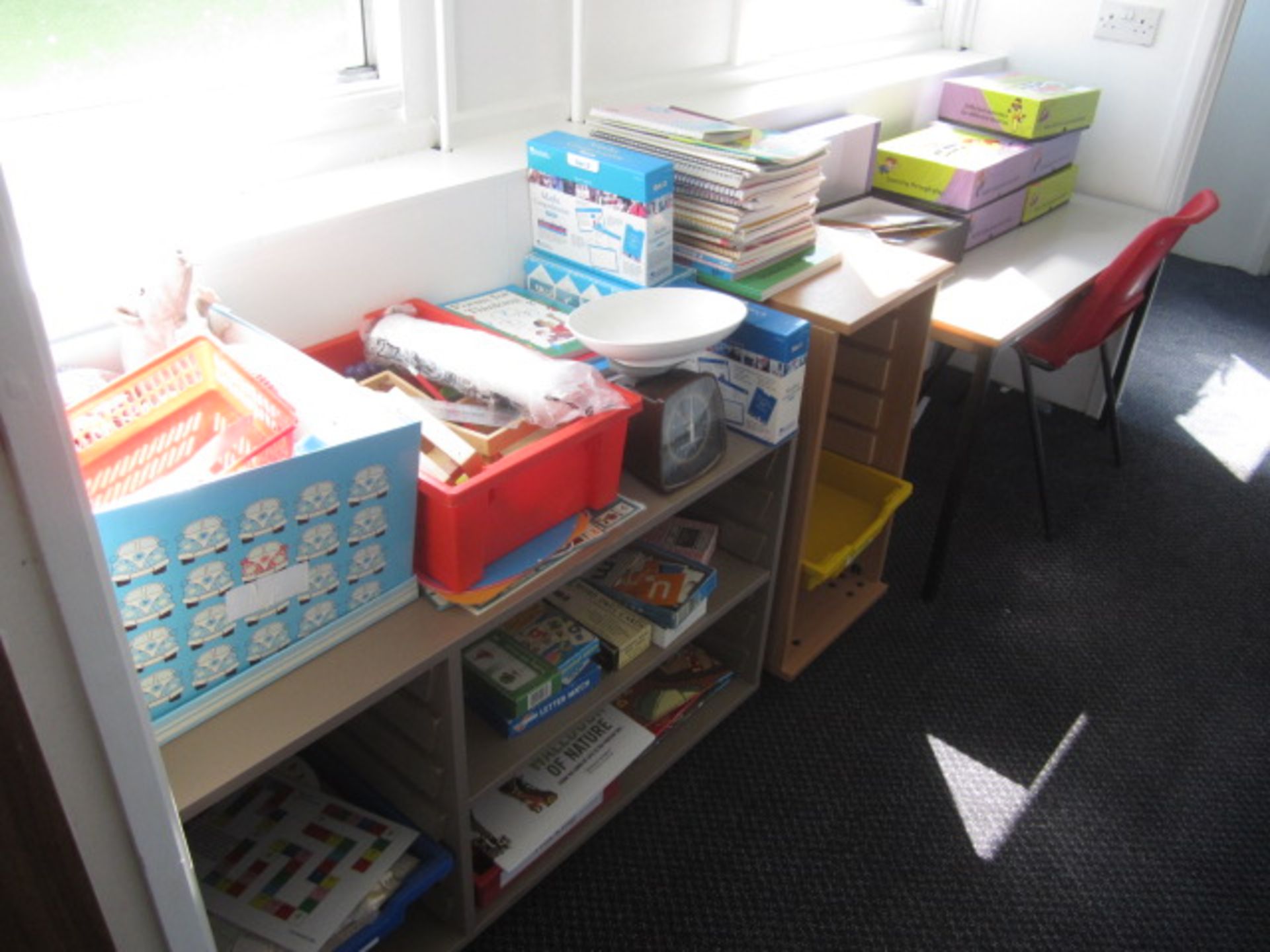 2 x storage units with contents including games, teaching aids etc., table, chair,Located at main