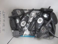 Twelve assorted hand held radios, assumed working
