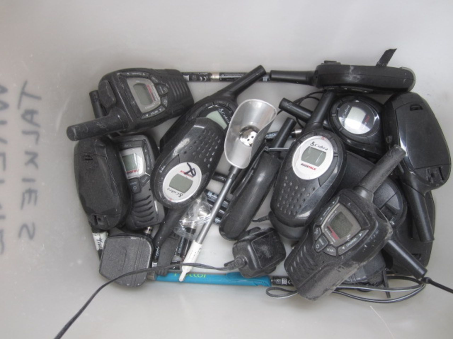 Twelve assorted hand held radios, assumed working