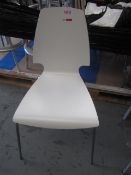 Four white wooden high back chairs