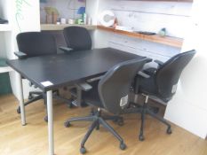 1500 x 750mm black laminate table and four black cloth upholstered chairs