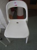 Six plastic moulded chairs, white
