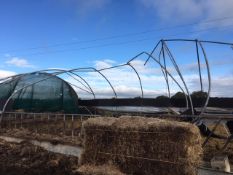 Galvanised poly tunnel frame, approx. 30m x 10m - covered, please note storm damage. **A work...