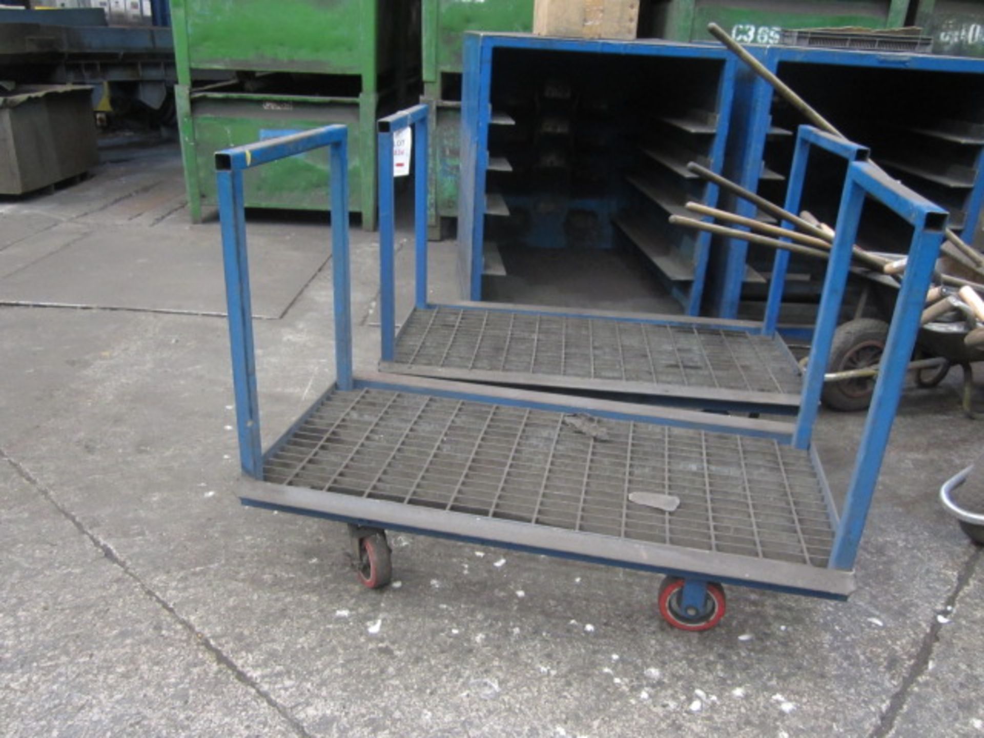 Two metal frame/mesh base trolleys, 1460 x 635mm