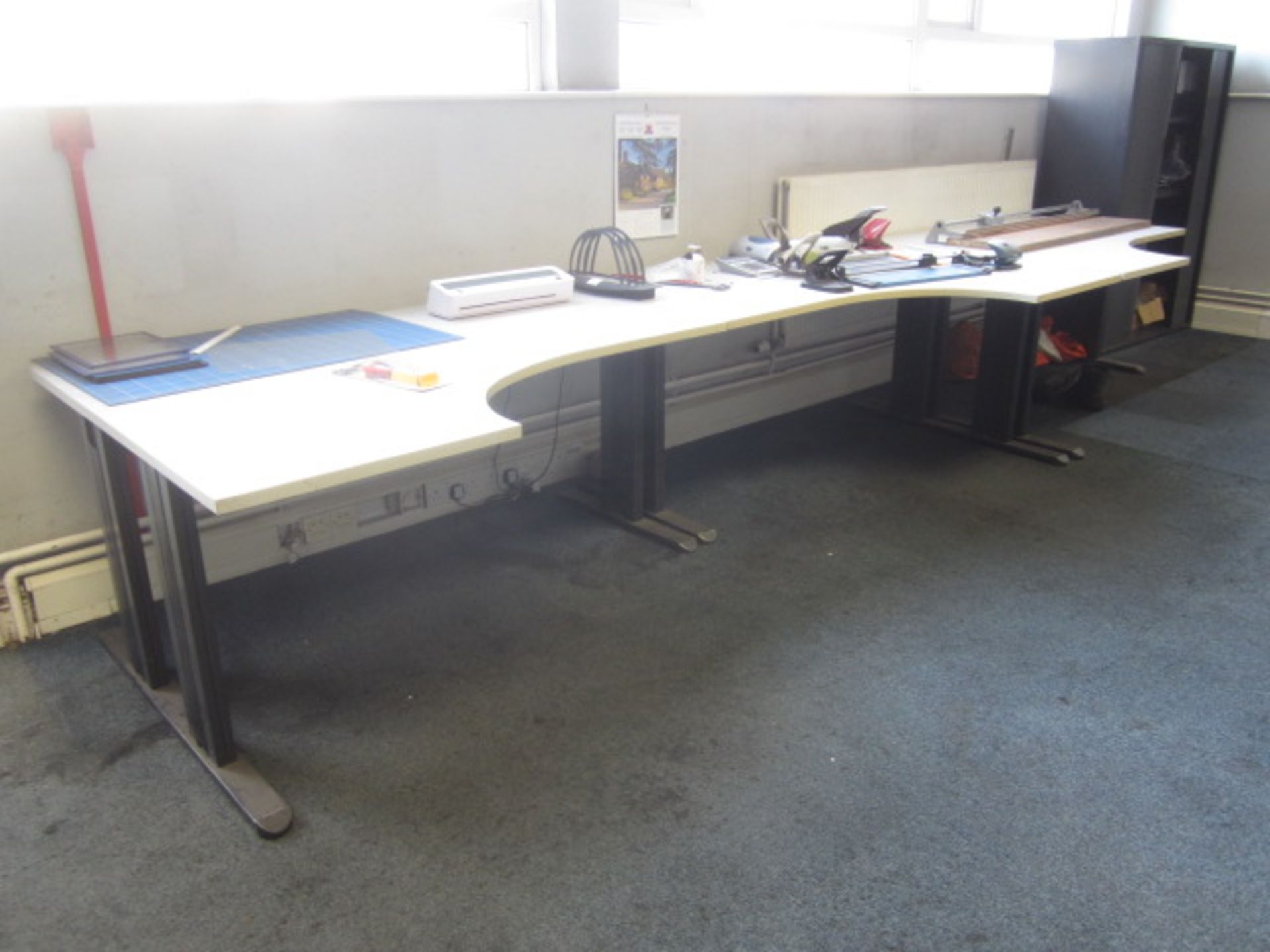 Three grey melamine corner workstations