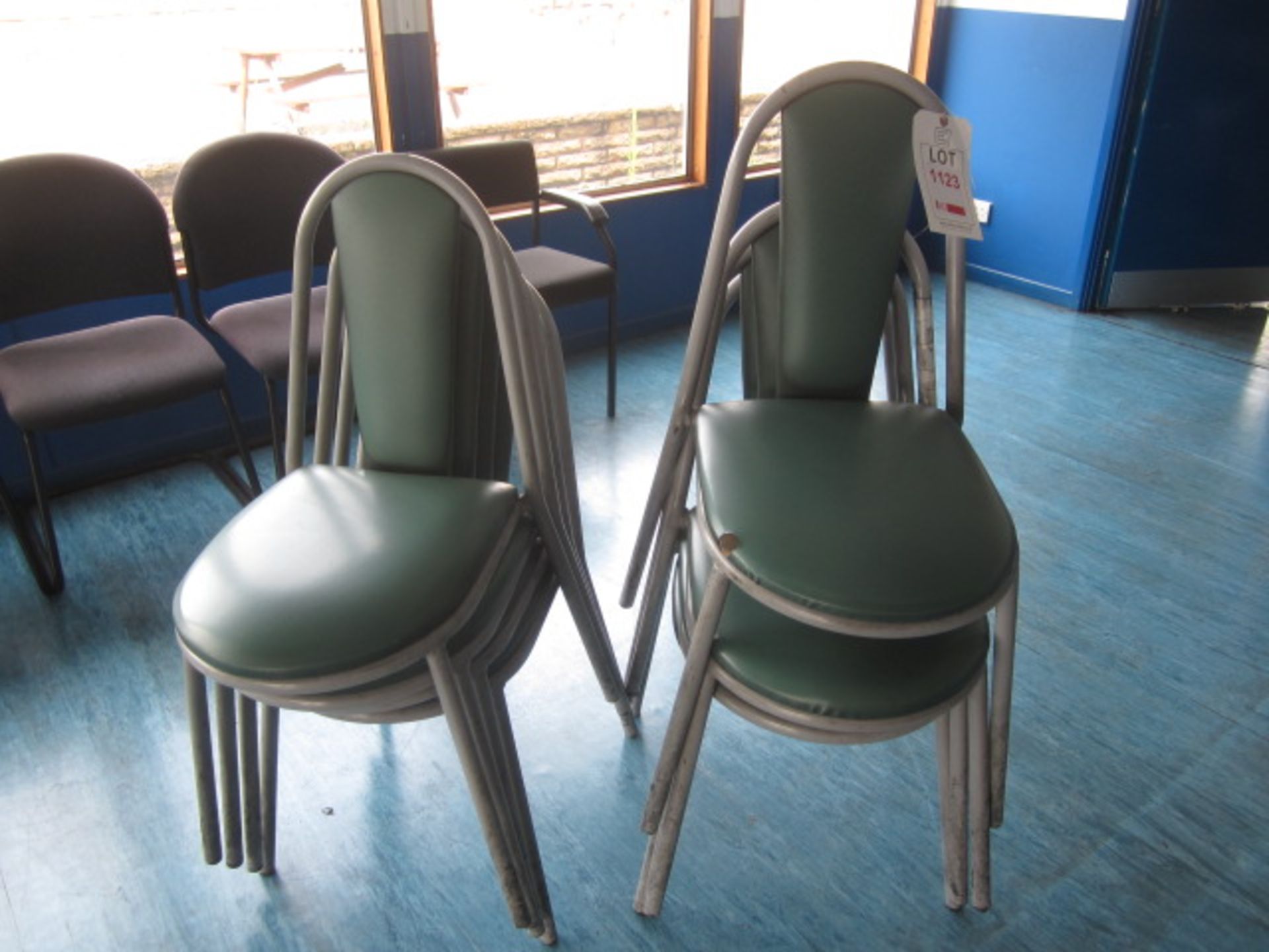 Eight metal frame vinyl stacking canteen chairs