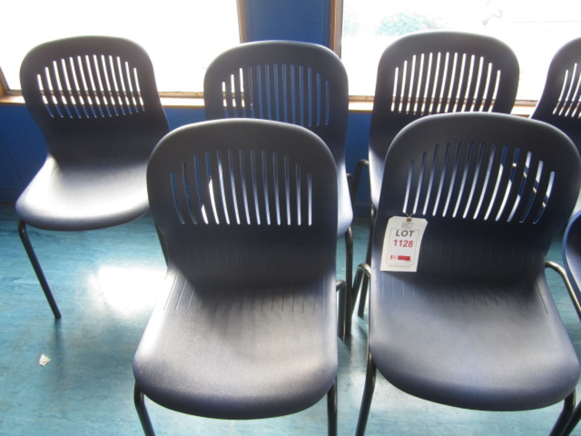 Five metal frame plastic moulded stacking canteen chairs