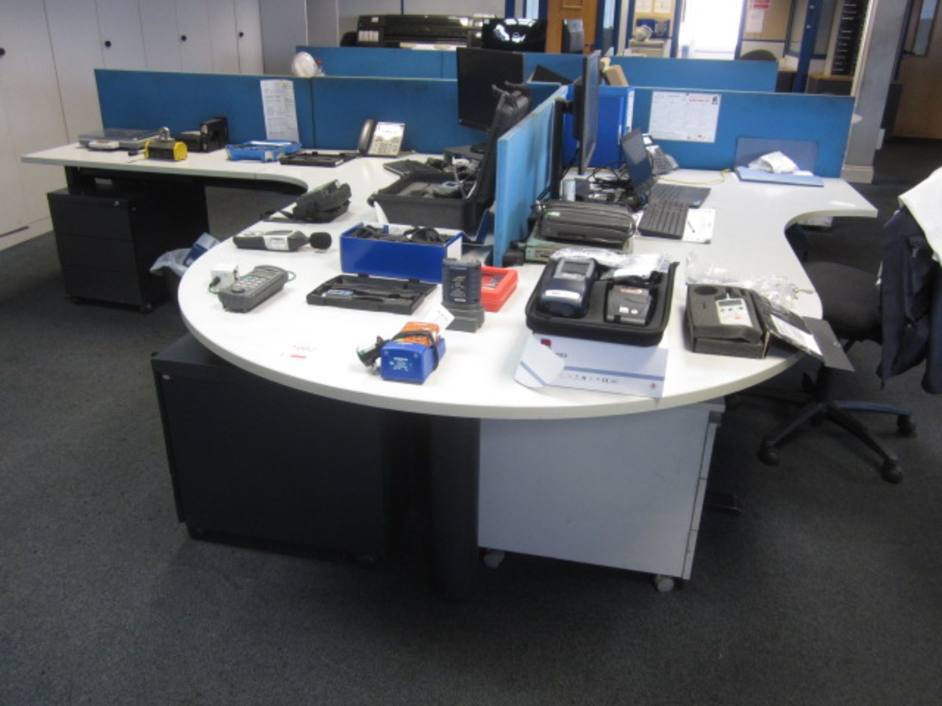 Two grey melamine corner workstations, one semi circle end section, one table with under desk