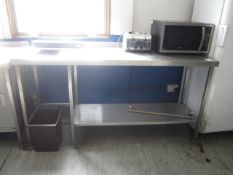 Stainless steel free standing work table with undershelf, waste hole, approx. size 1.8m x 600mm x