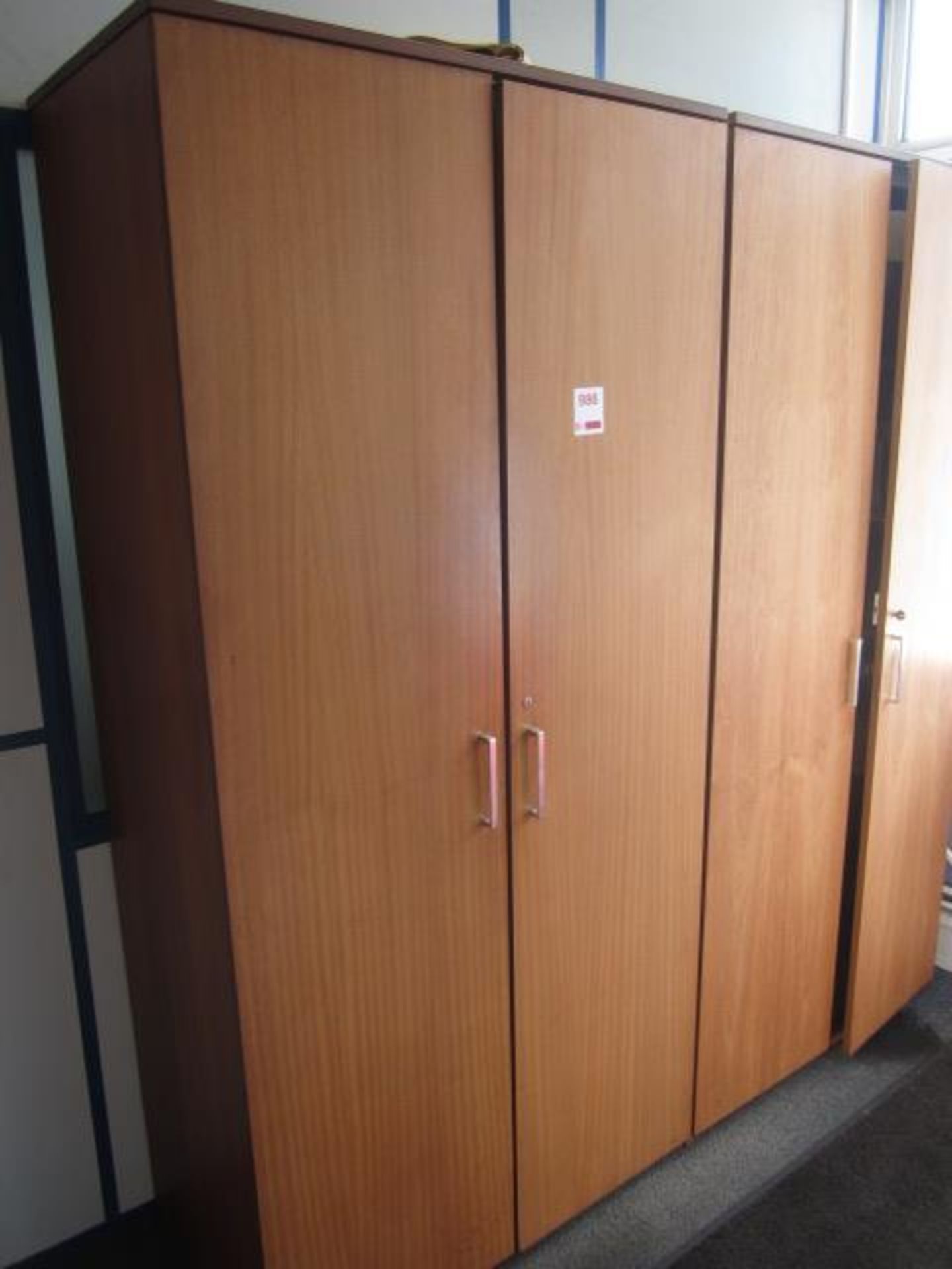 Two wood effect full height 2 door storage cupboards, excluding contents