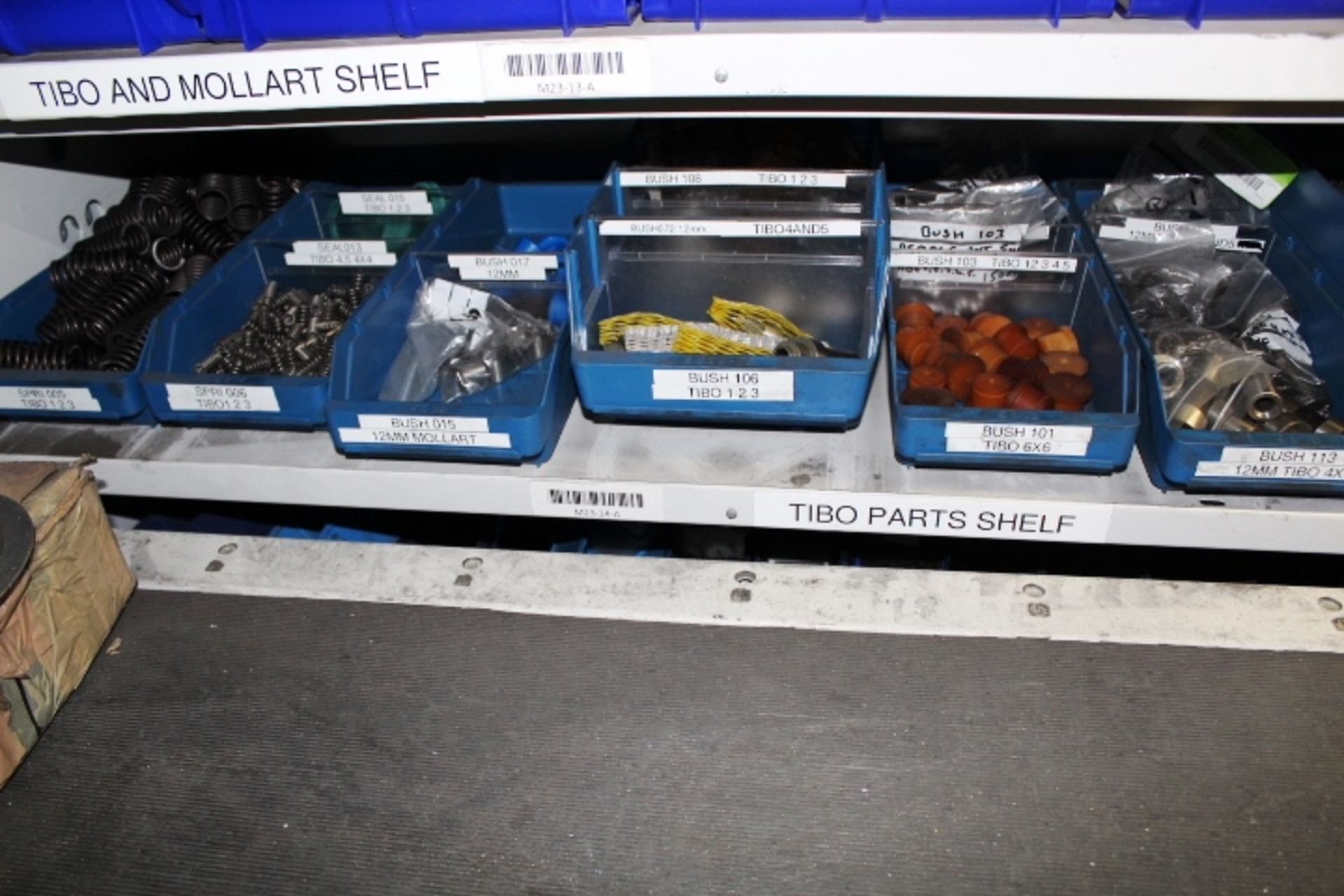 Shelf of assorted stock contents to include Tibo springs, Mollart bushes, Tibo bushes, Tibo canes,