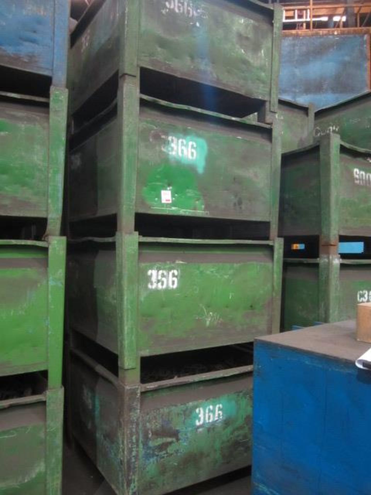 Four metal forkliftable stacking storage bins, approx. size 48"x48"x34", excluding contents