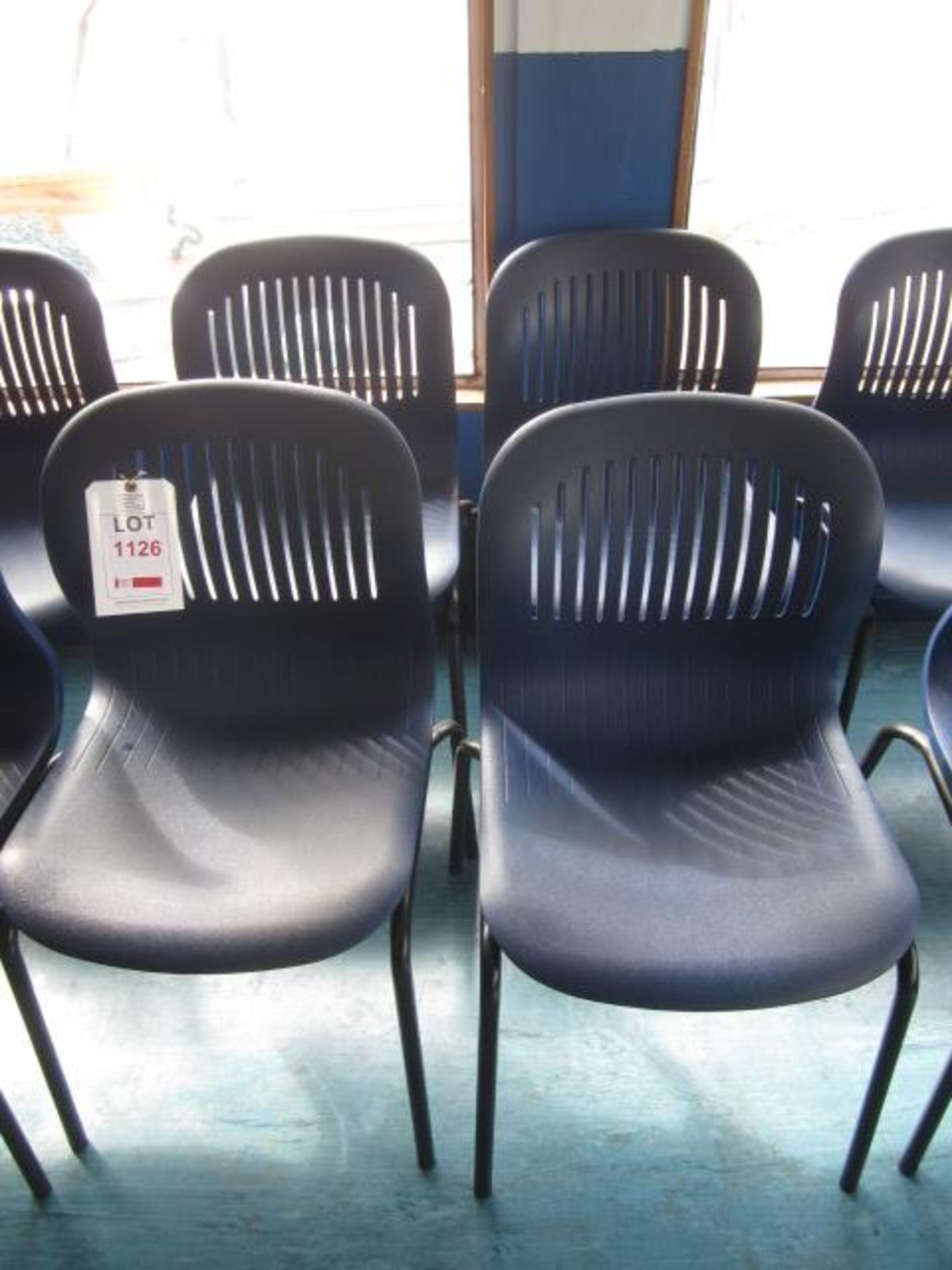 Four metal frame plastic moulded stacking canteen chairs