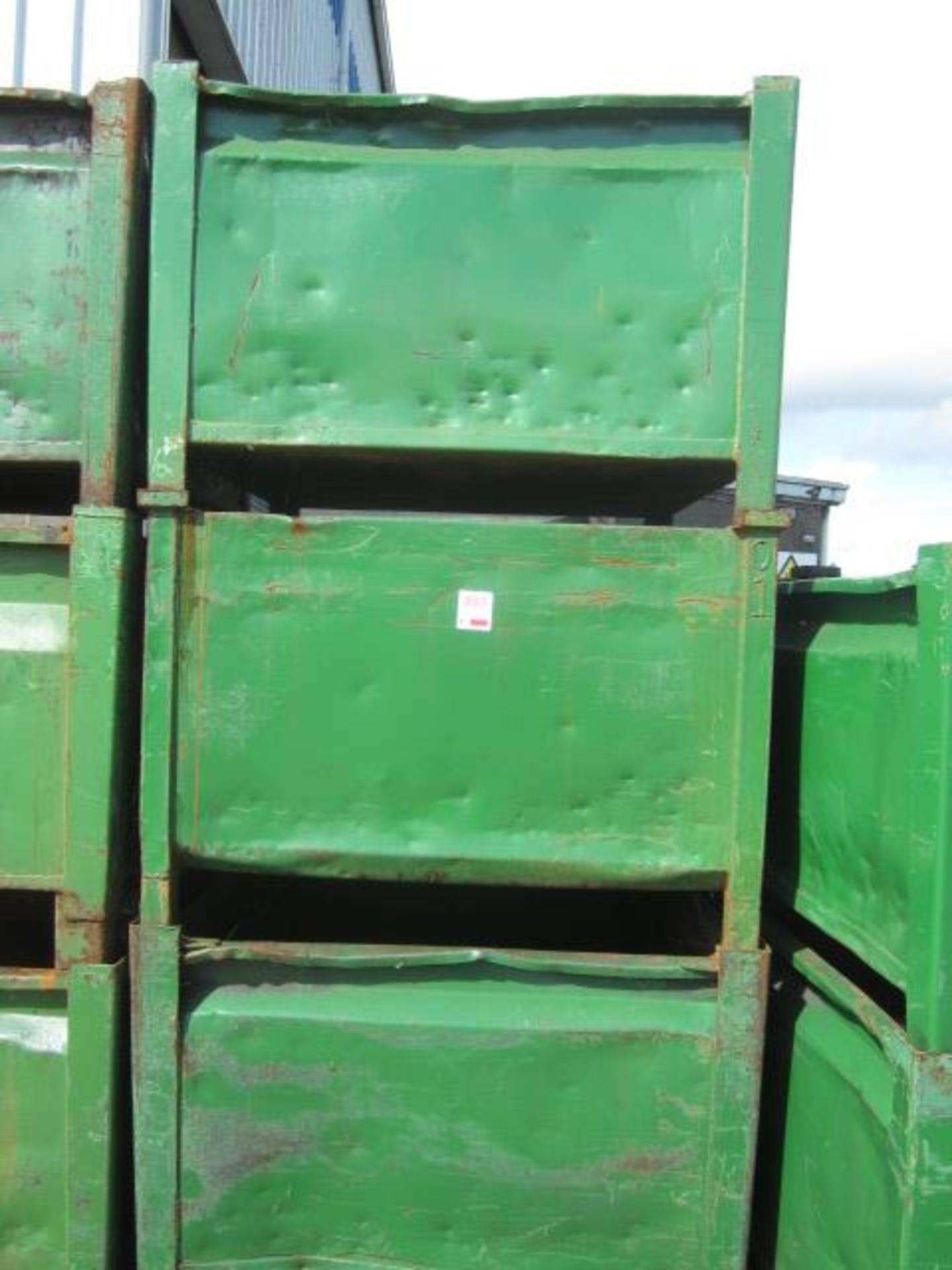 Four metal forkliftable stacking storage bins, approx. size 48"x48"x34", excluding contents