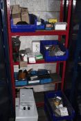 Rack and contents of assorted electrical stock, control panels, tags, etc.