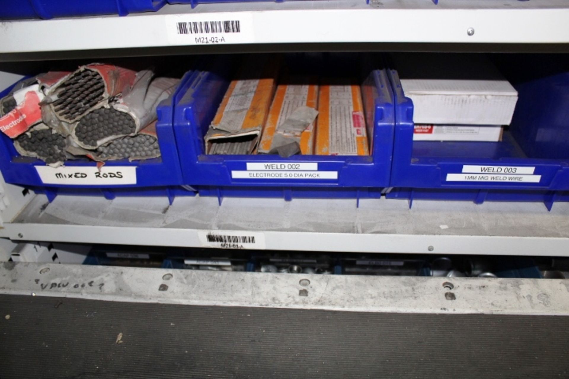 Shelf of assorted stock contents to include large quantity of associated welding rods/electrods,